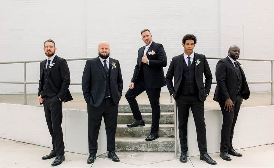 Groom and groomsmen in black suits