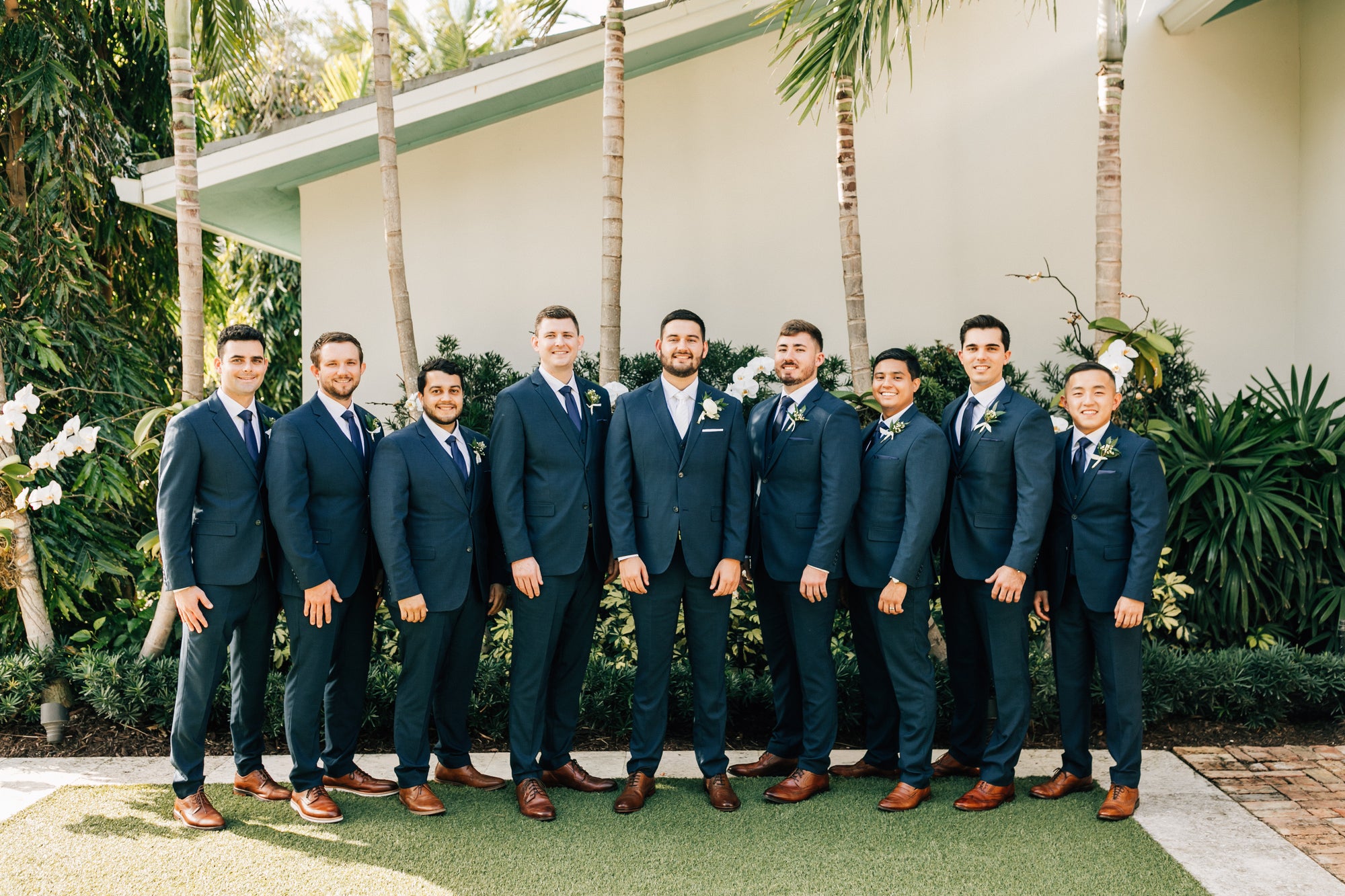 Groom and groomsmen in wedding suits