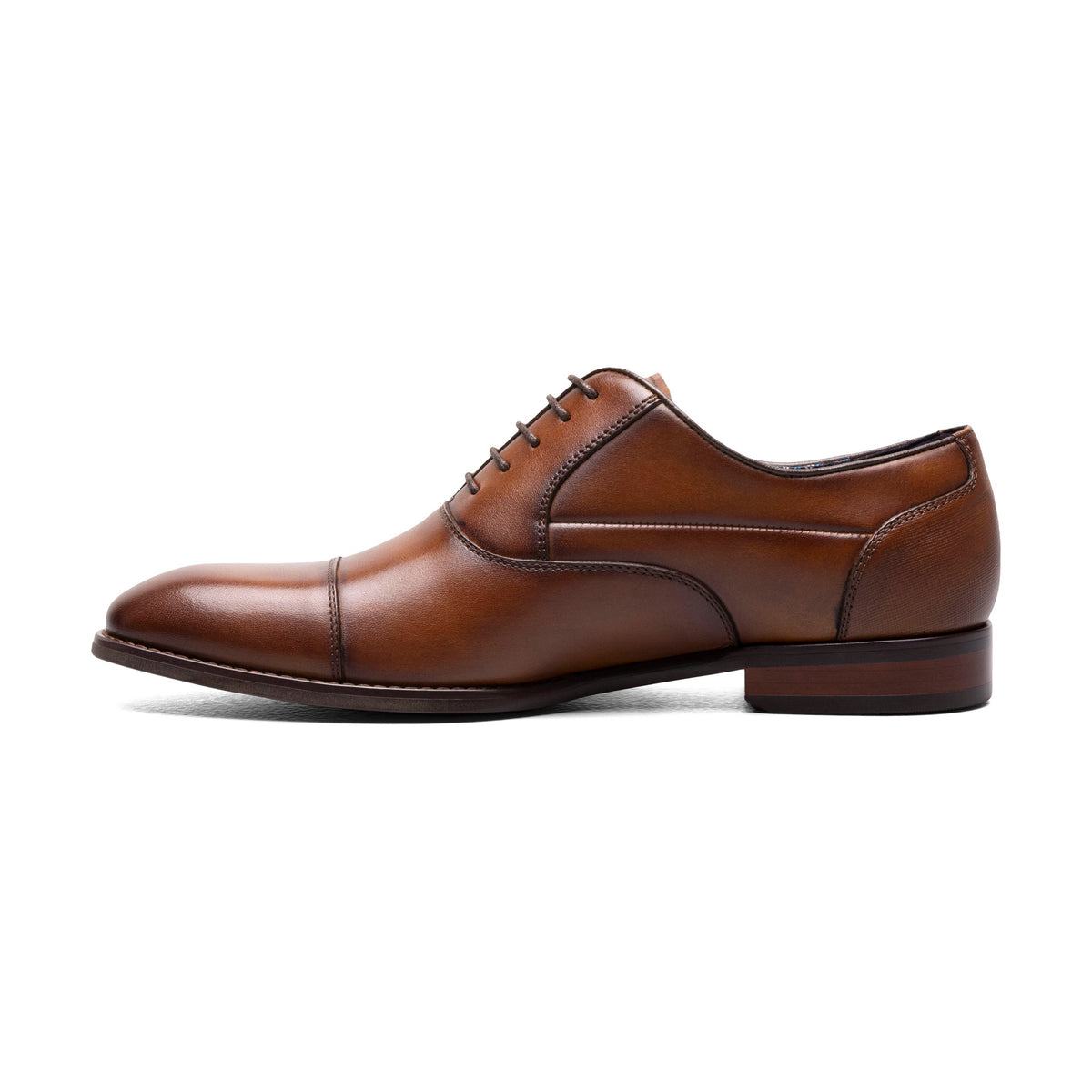 Cognac cap-toe dress shoe, side view