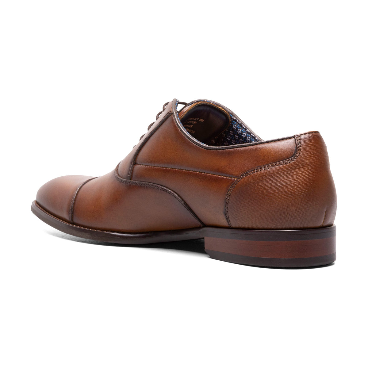 Cognac cap-toe dress shoe, back three-quarter view