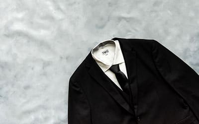 Black suit and tie by Modern Groom.