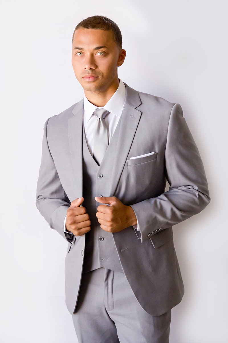 A man in a light-grey suit.