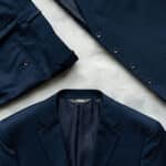 Top-view of a navy suit bundle by Modern Groom.
