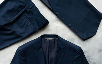 Top-view of a navy suit bundle by Modern Groom.