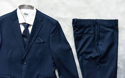 A navy blue suit and tie, with pants.