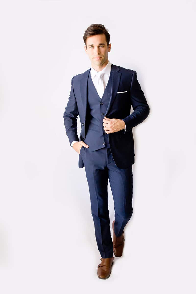 Man in a navy blue suit.