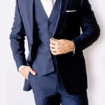 Midnight blue Modern Groom suit and white tie.