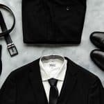Black Modern Groom suit package with socks, belt, and shoes.