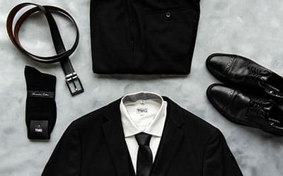 Black Modern Groom suit package with socks, belt, and shoes.