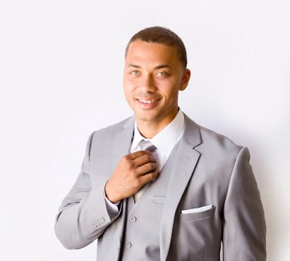 Cropped shot of a male model wearing a light-gray wedding suit.