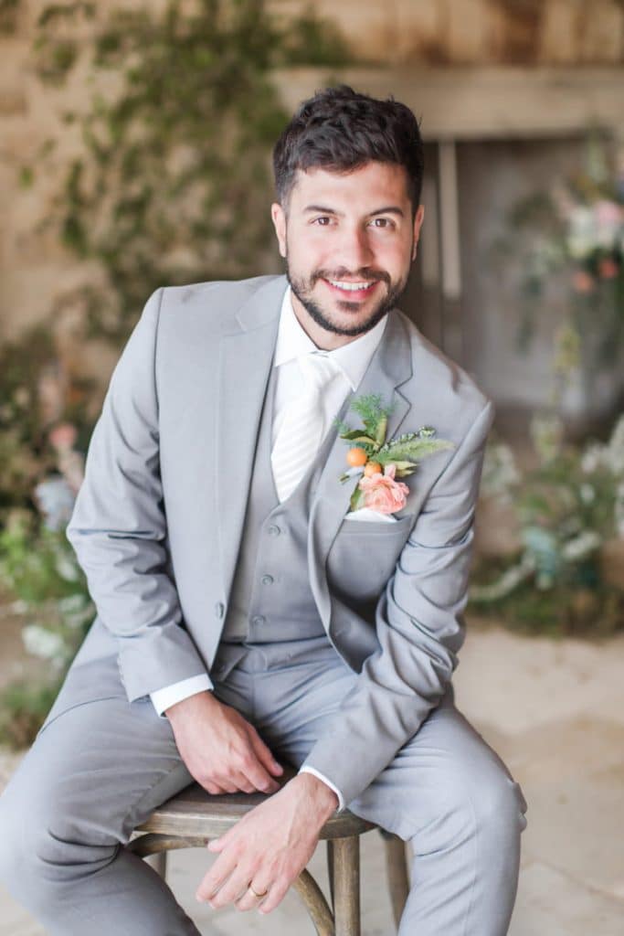 A man wearing the light grey wedding suit from The Modern Groom