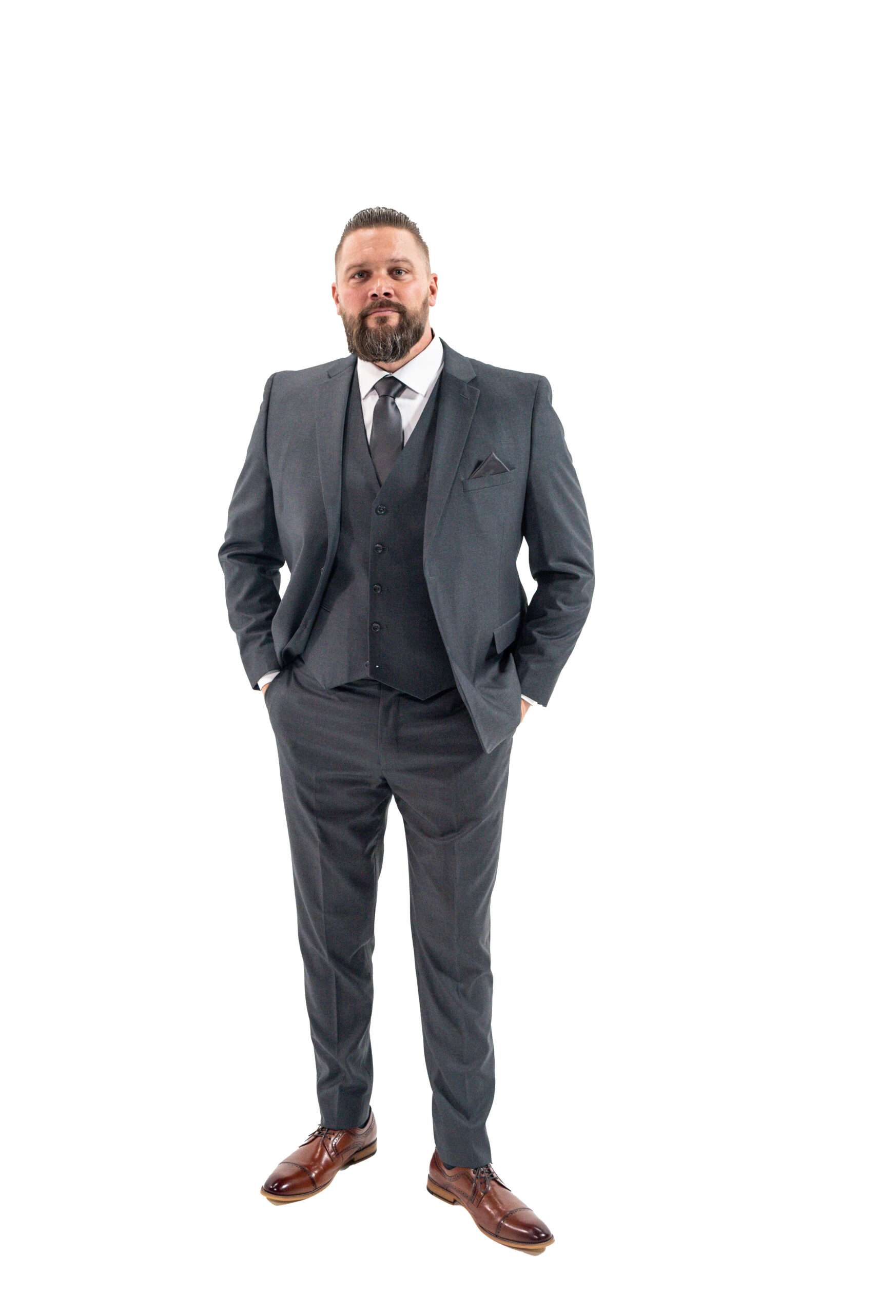 man standing in a charcoal suit