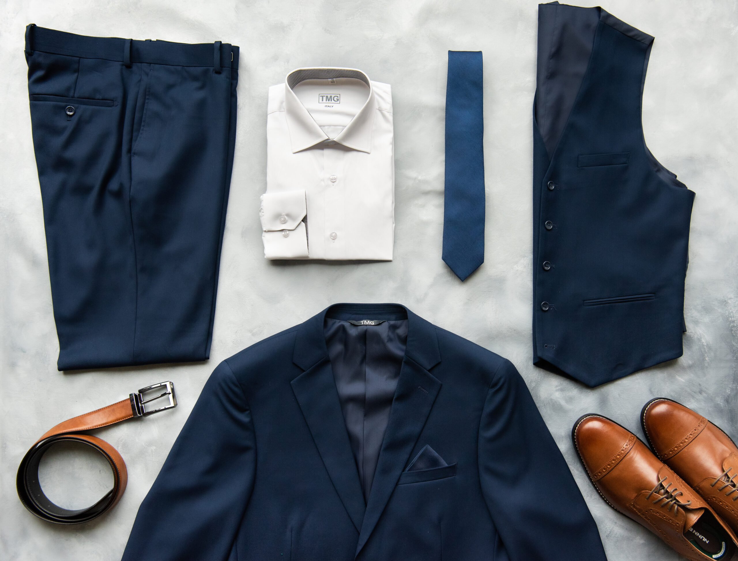 A navy blue suit lay for date night