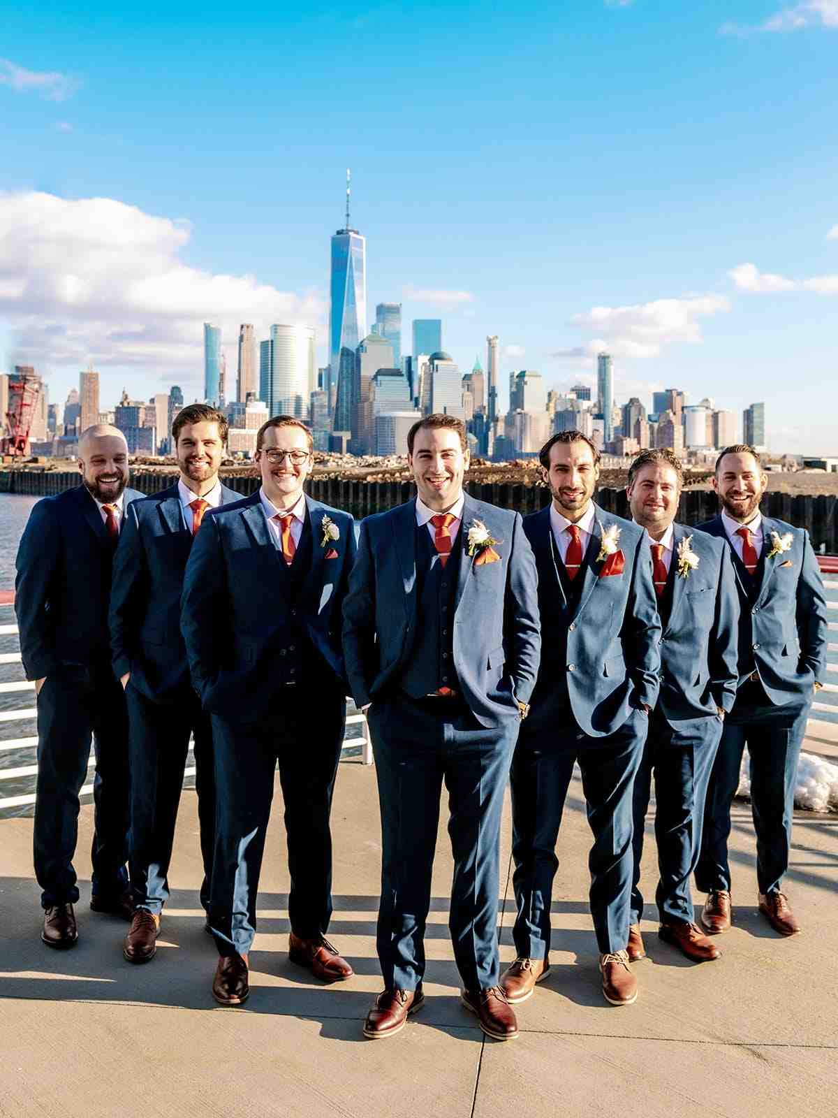 Groomsmen pose together in semi formal wedding attire