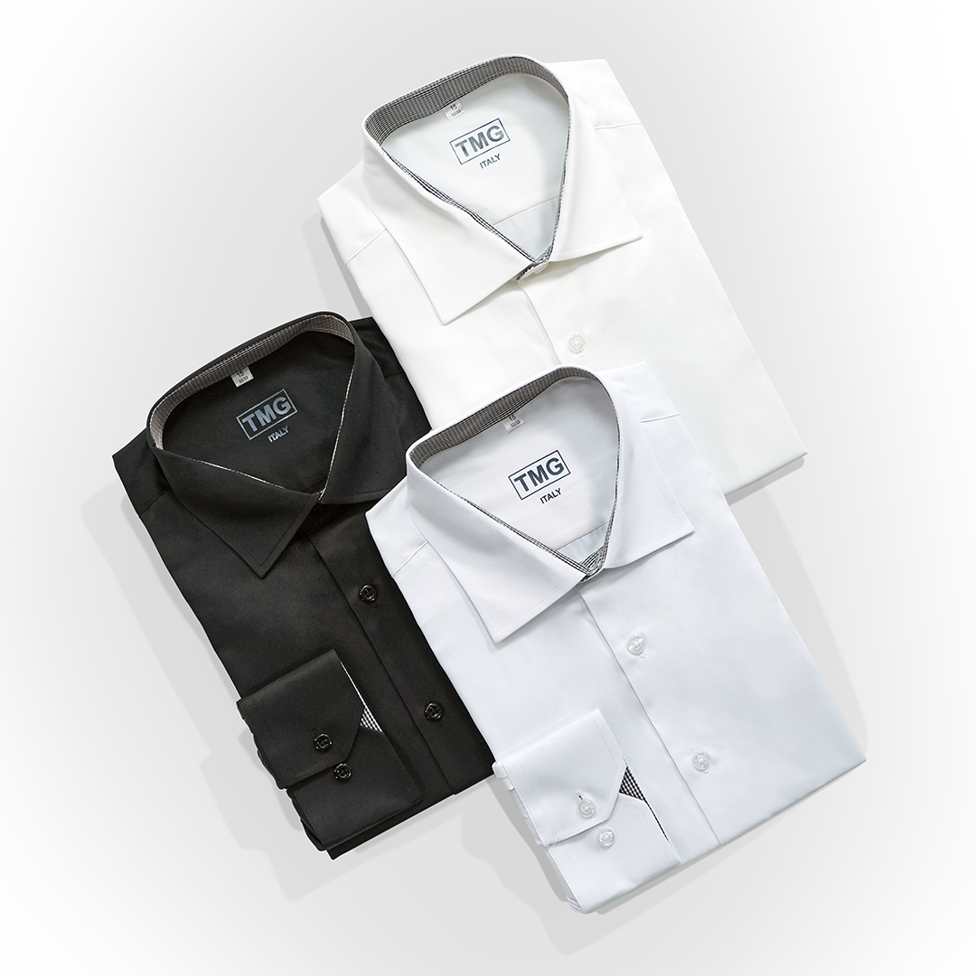 Flat lay of three different colors of dress shirts from The Modern Groom